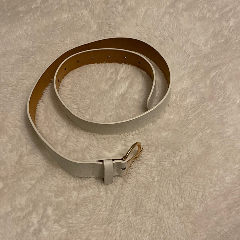 White belt made from faux leather and gold/ metal loop